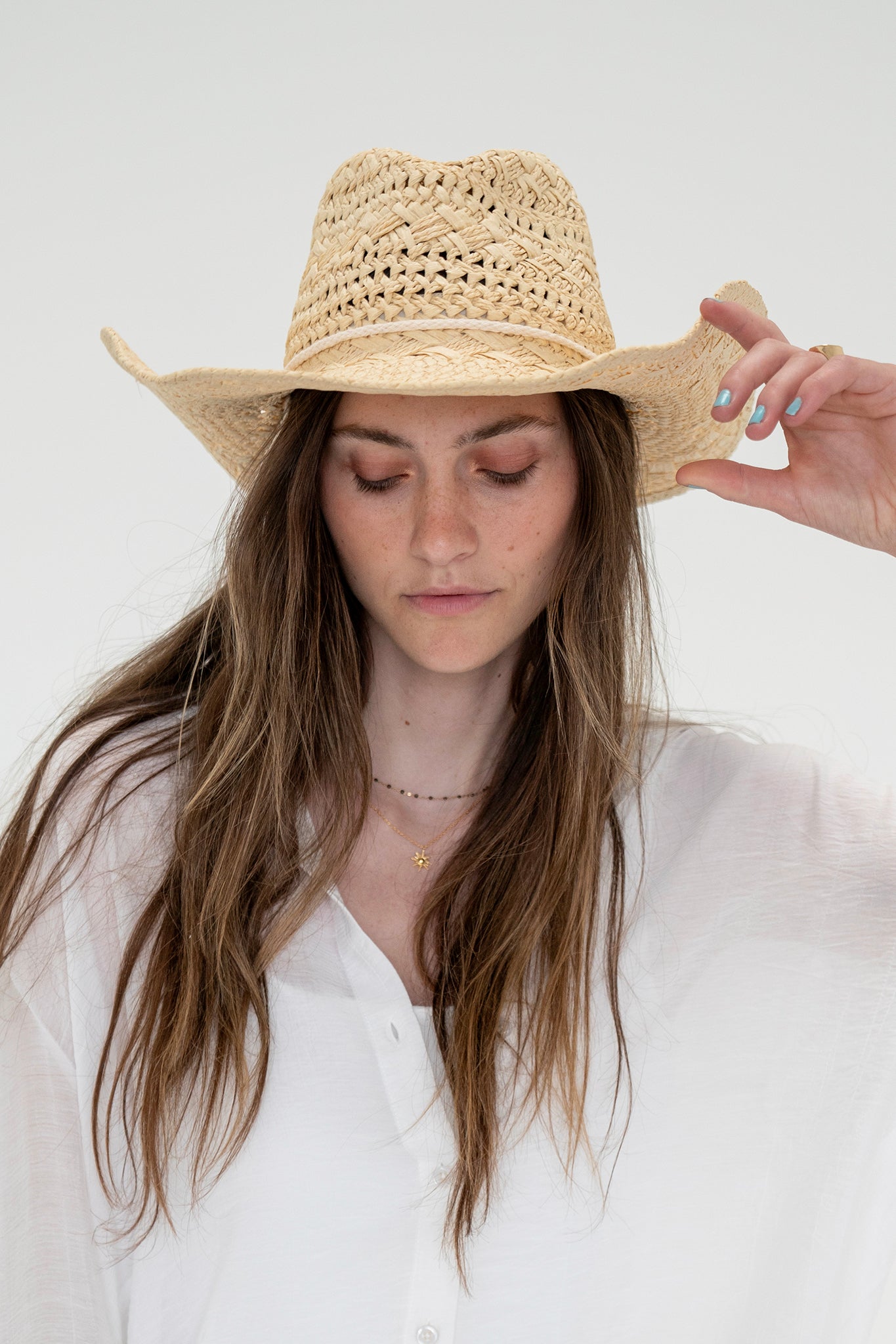 View 3 of Capo Straw Cowboy Hat in Ivory, a Hats from Larrea Cove. Detail: .
