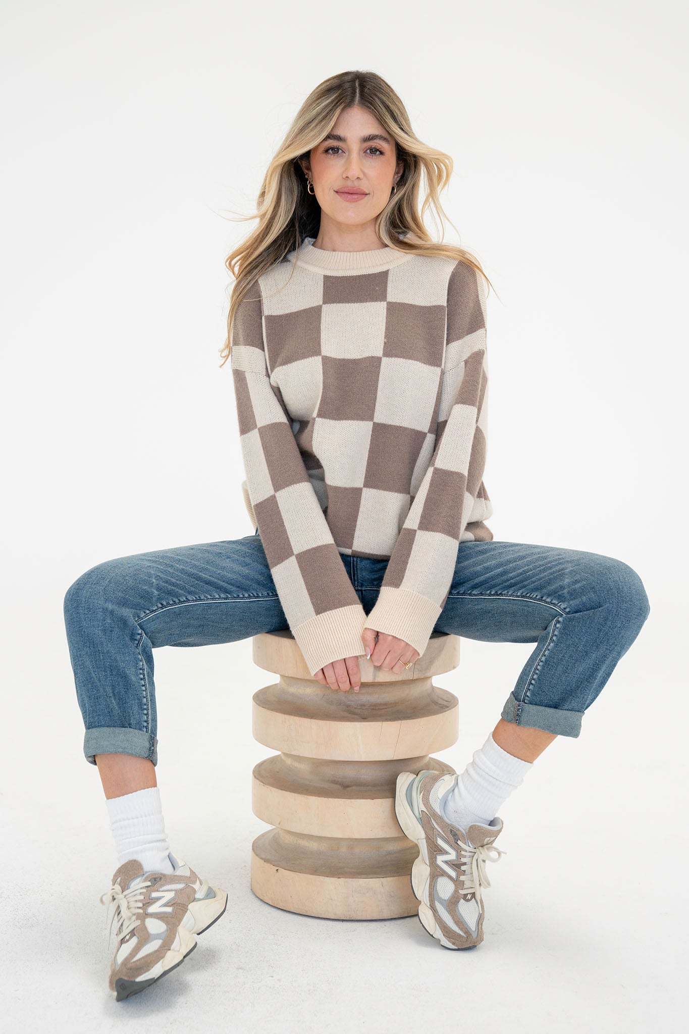 View 1 of Checkered Sweater Top, a nan from Larrea Cove. Detail: Create a on-trend look with our oversized Chec...