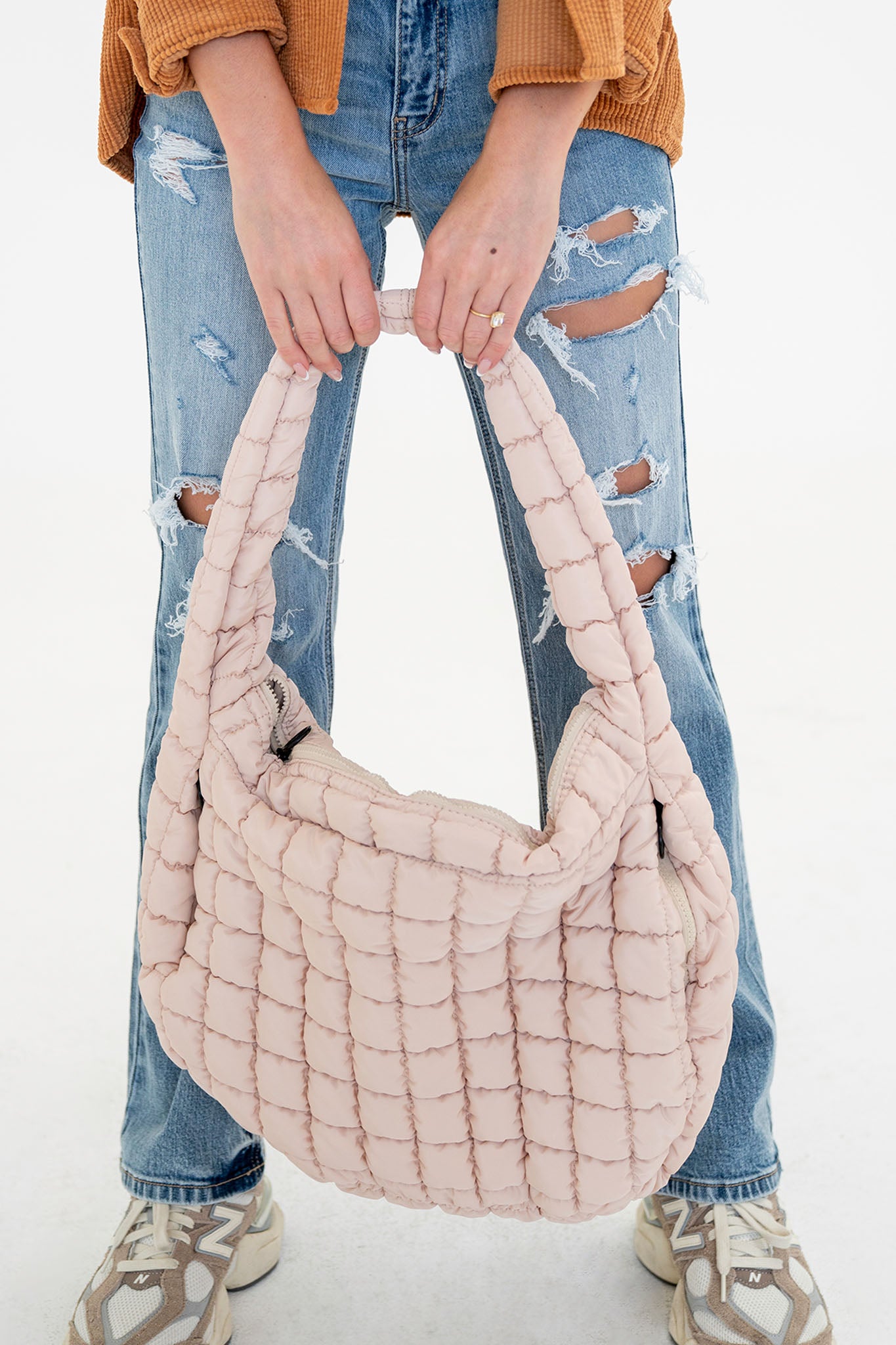 View 3 of Cleo Quilted Hobo Bag in Ivory, a Bags from Larrea Cove. Detail: .