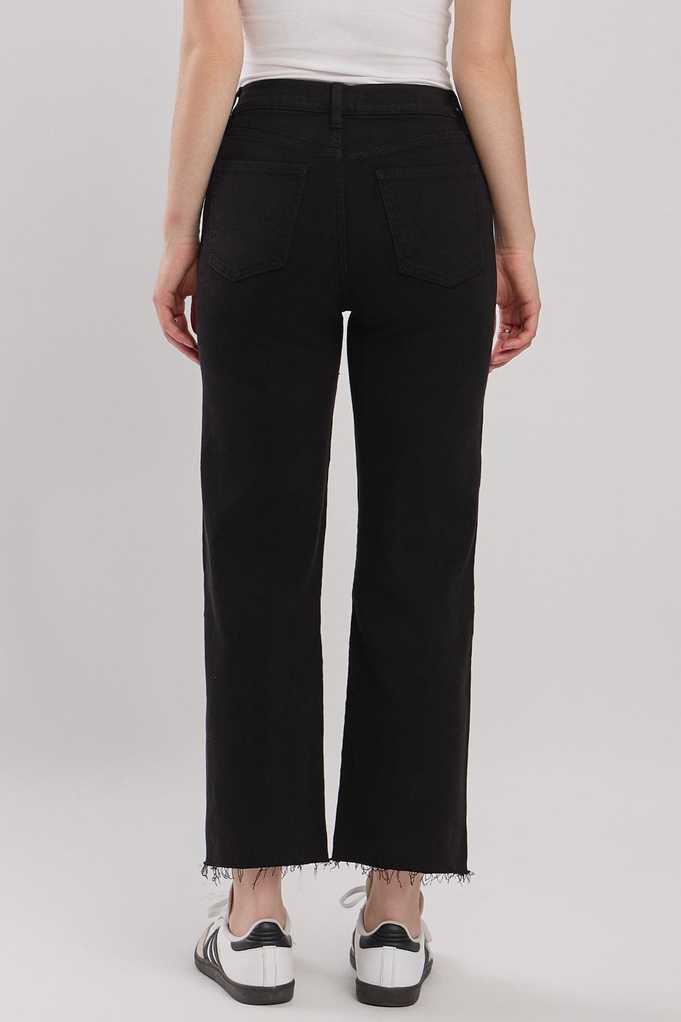 Eunina Dawn Wide Leg Jeans in Sable, featuring a relaxed fit and light beige color. The jeans are styled with a pair of trendy sunglasses placed nearby.