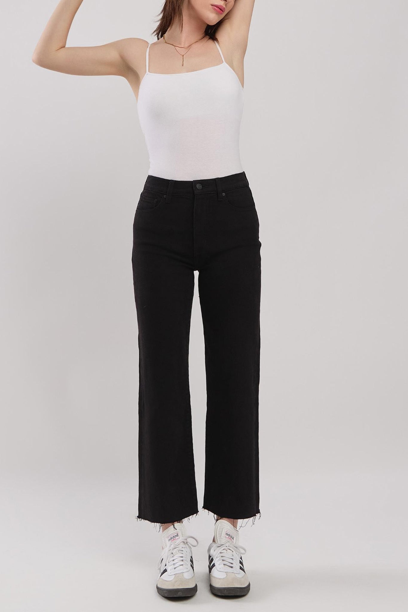 Eunina Dawn Wide Leg Jeans in Sable, featuring a light beige color and a stylish wide-leg cut. Accompanied by a pair of trendy sunglasses, representing the latest fashion for August 2024.