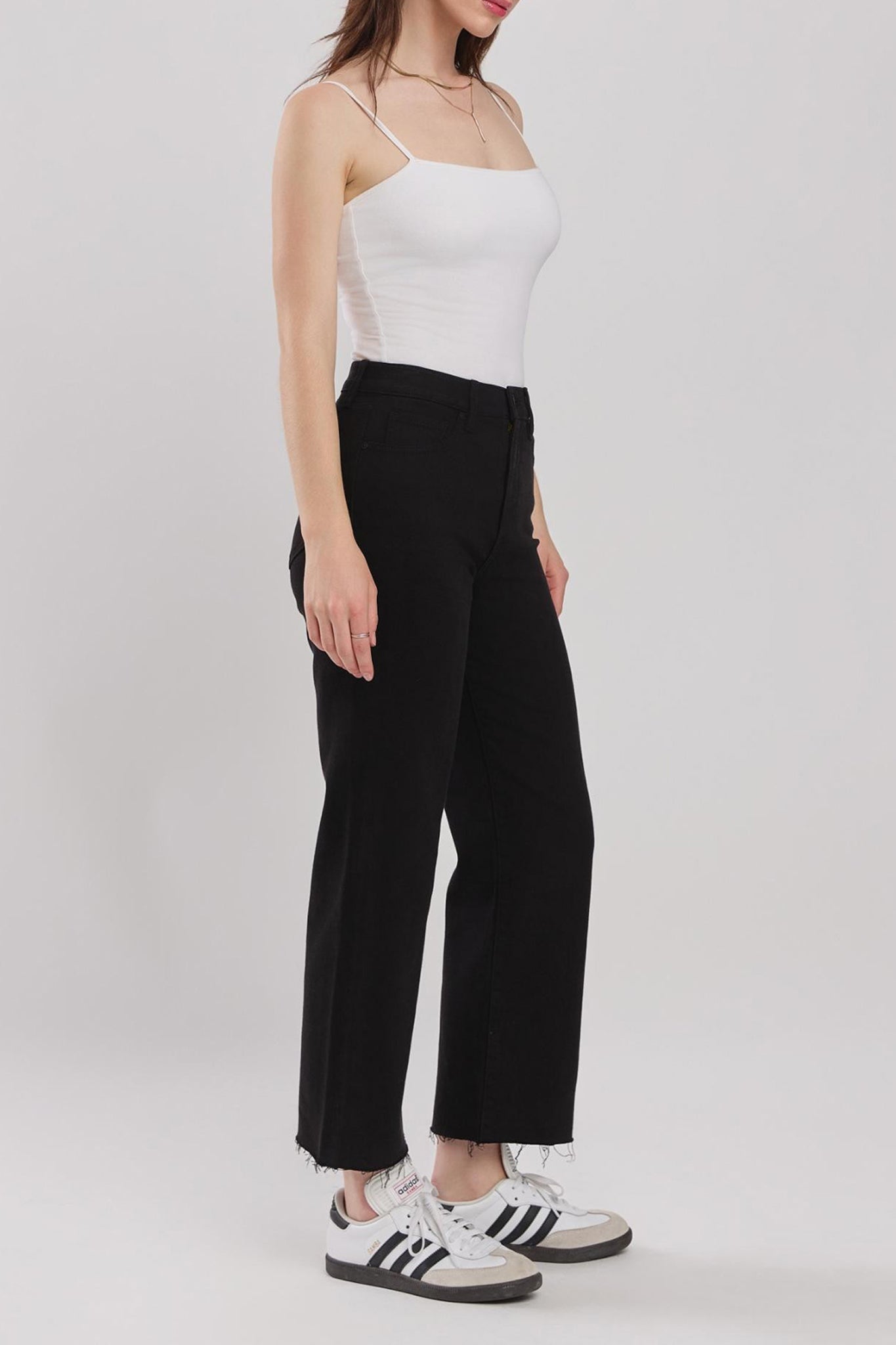 Eunina Dawn Wide Leg Jeans in Sable, featuring a light tan color and a relaxed fit. The jeans are styled with sunglasses and are part of the Eunina brand's new collection for August 2024.