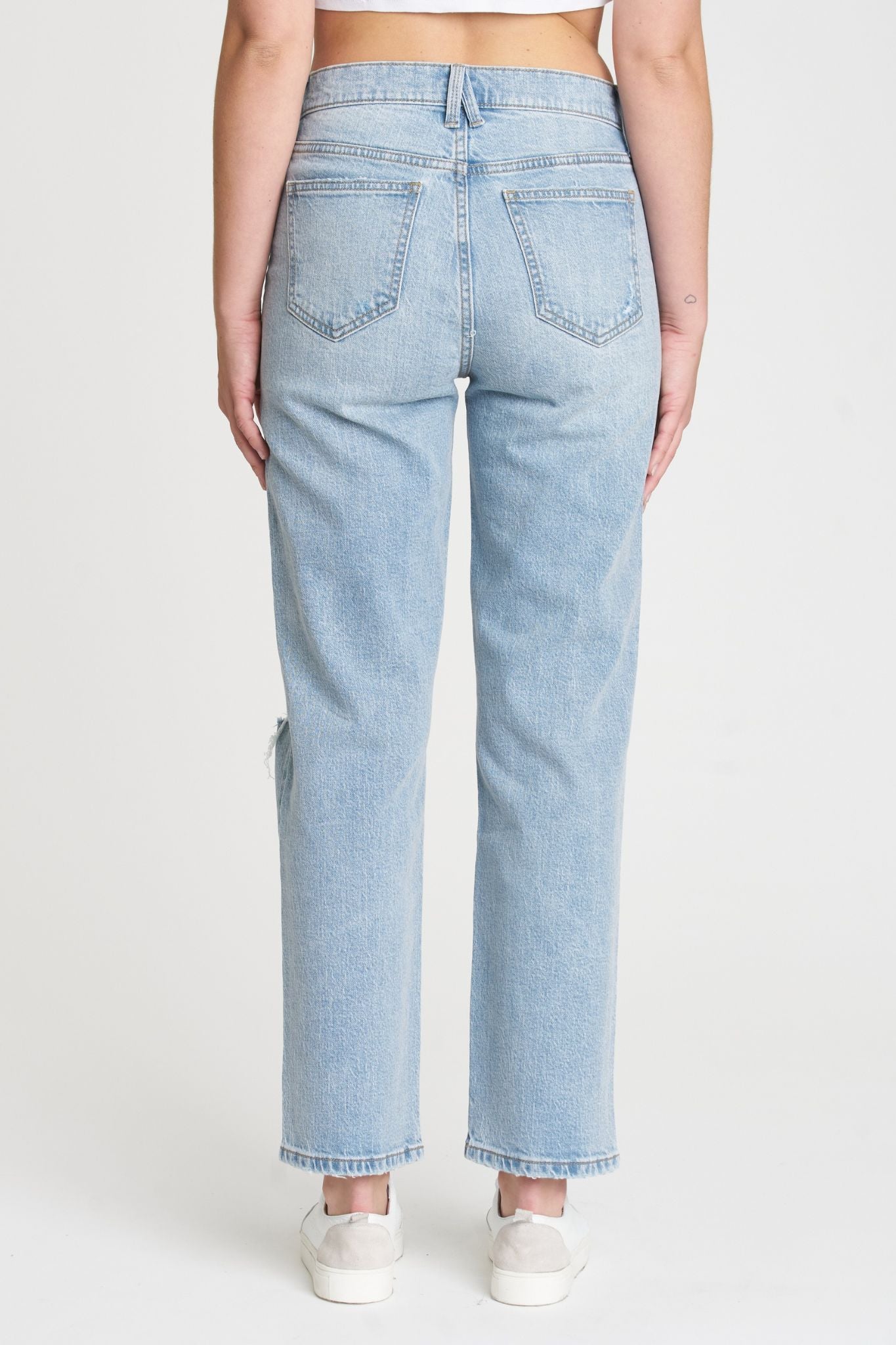 A pair of Eunina Olsen Straight Leg Jeans in the Polem color. The jeans feature a classic straight-leg cut and are styled with a casual look. Accompanying the jeans are a pair of stylish sunglasses. The product is tagged as new for July 2024, categorized under jeans, and is part of the Eunina brand.