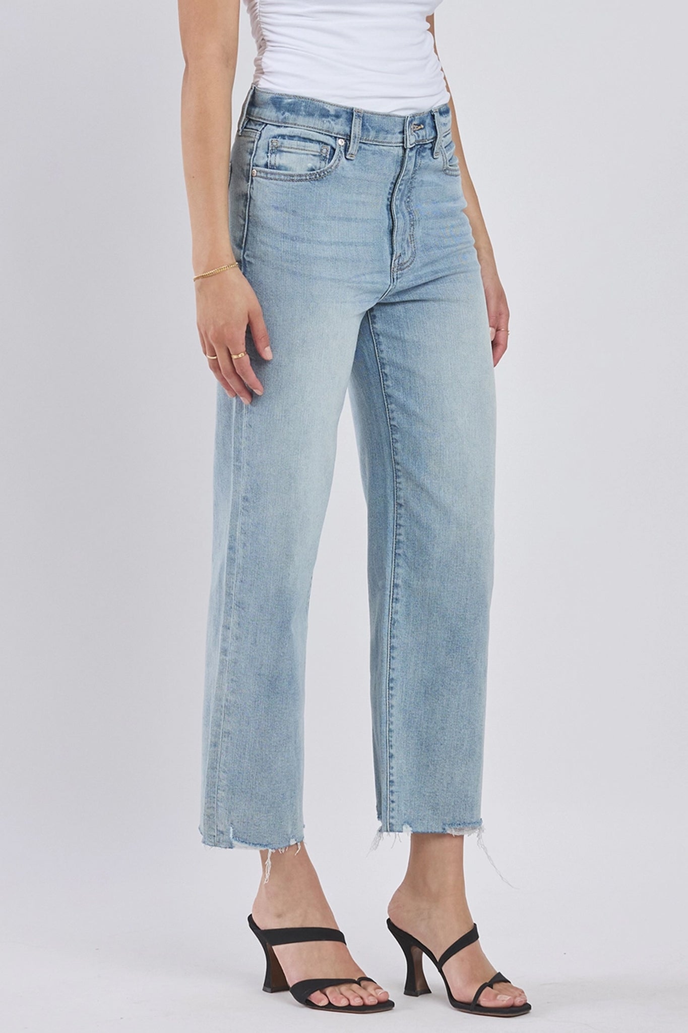 Pair of Eunina Dawn Wide Leg Jeans in a vibrant 'Sunsets' color, displayed with sunglasses. The jeans feature a relaxed, wide-leg fit suitable for casual wear.