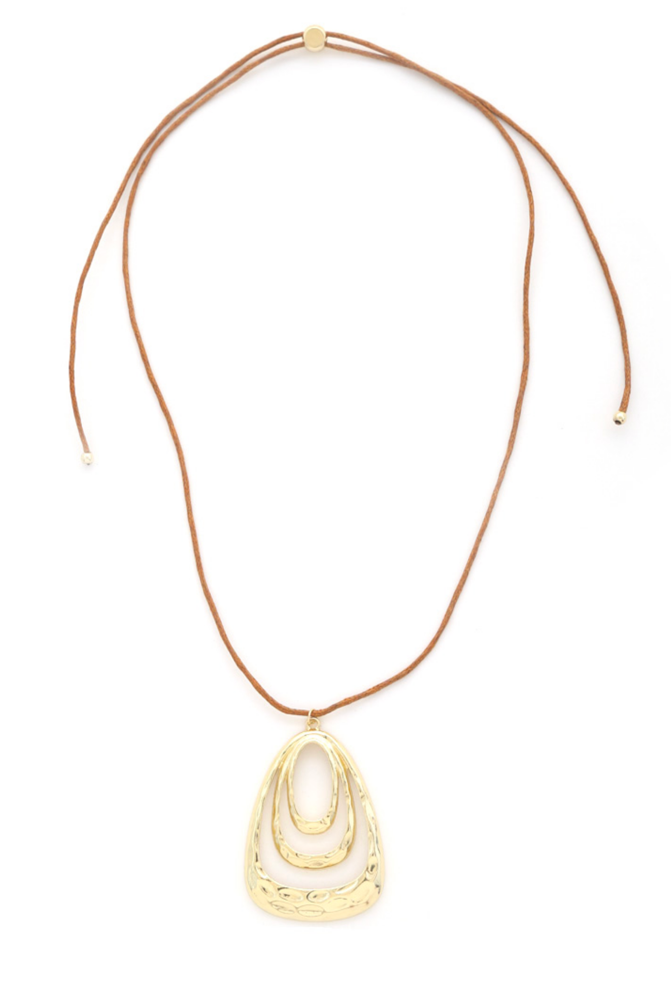 Gold brown hammered coin pendant necklace from the Euro Collection by Joia, showcased on a neutral background. The necklace features a textured pendant and is categorized under new jewelry for November 2023.