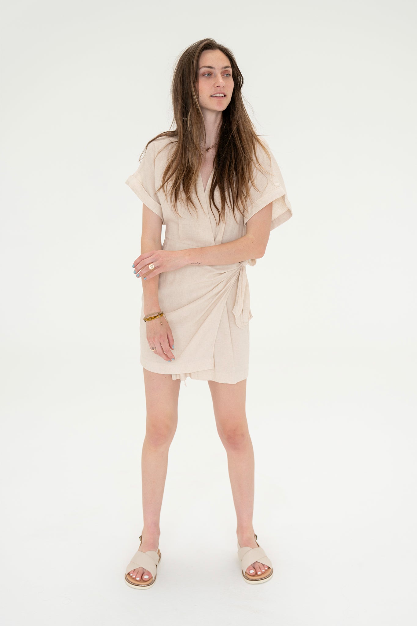View 1 of Hein Wrap Dress, a Dresses from Larrea Cove. Detail: The Hein Wrap Dress is a good neutral summer dress.