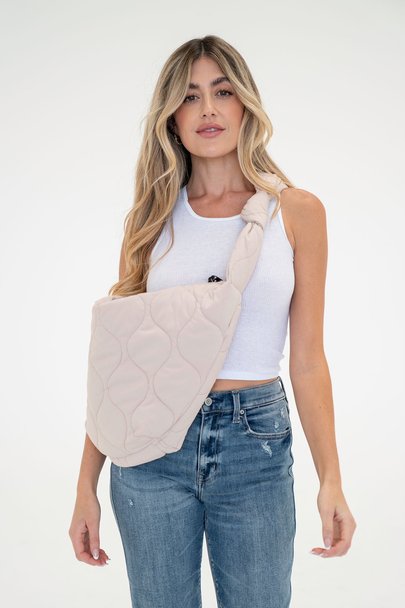 View 1 of Julia Quilted Shoulder Bag in Sand, a Bags from Larrea Cove. Detail: Introducing the Julia Quilted Shoulder Bag in Sand – a stylish, c...