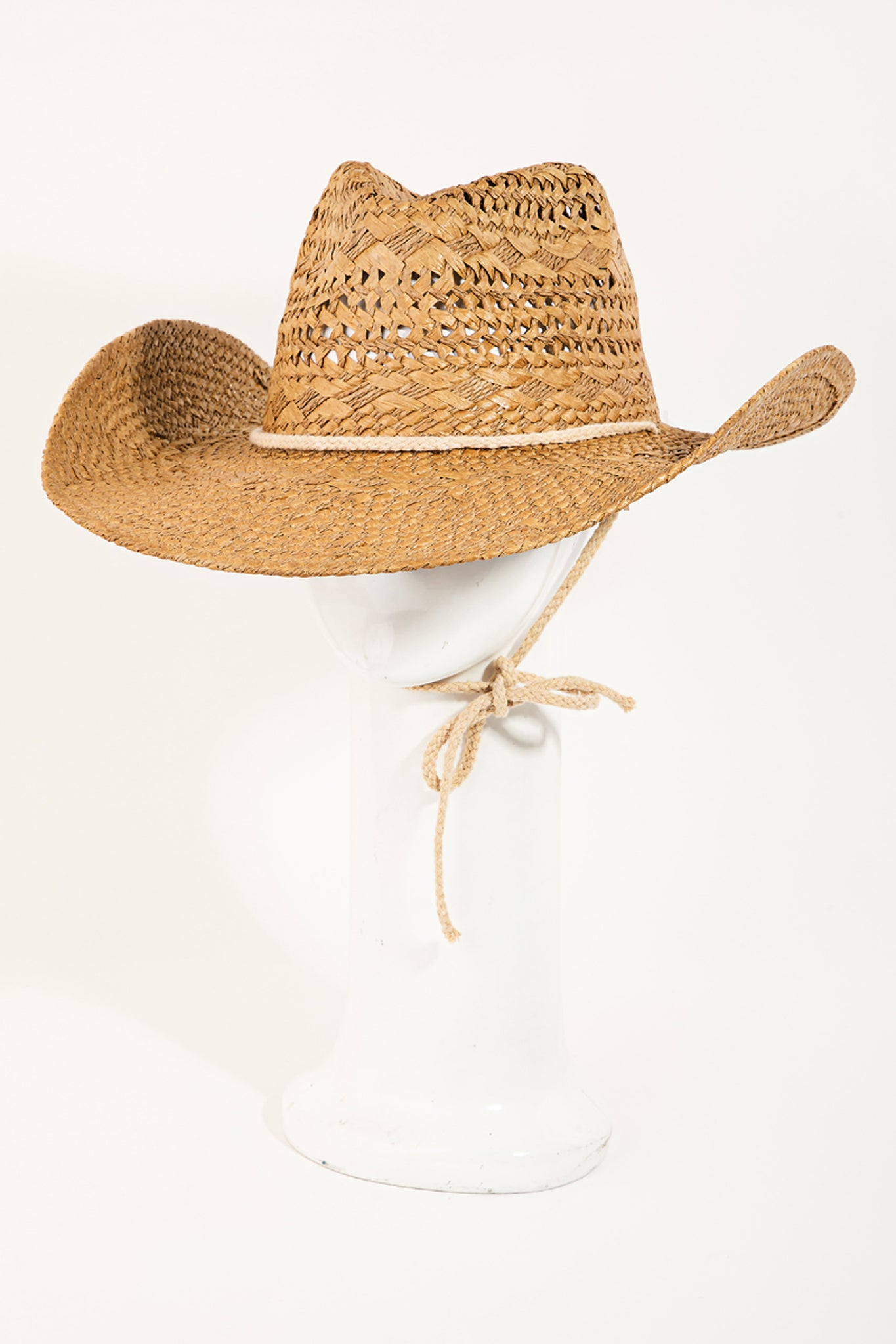 View 1 of Capo Straw Cowboy Hat in Khaki, a Hats from Larrea Cove. Detail: 
Add a touch of coastal c...