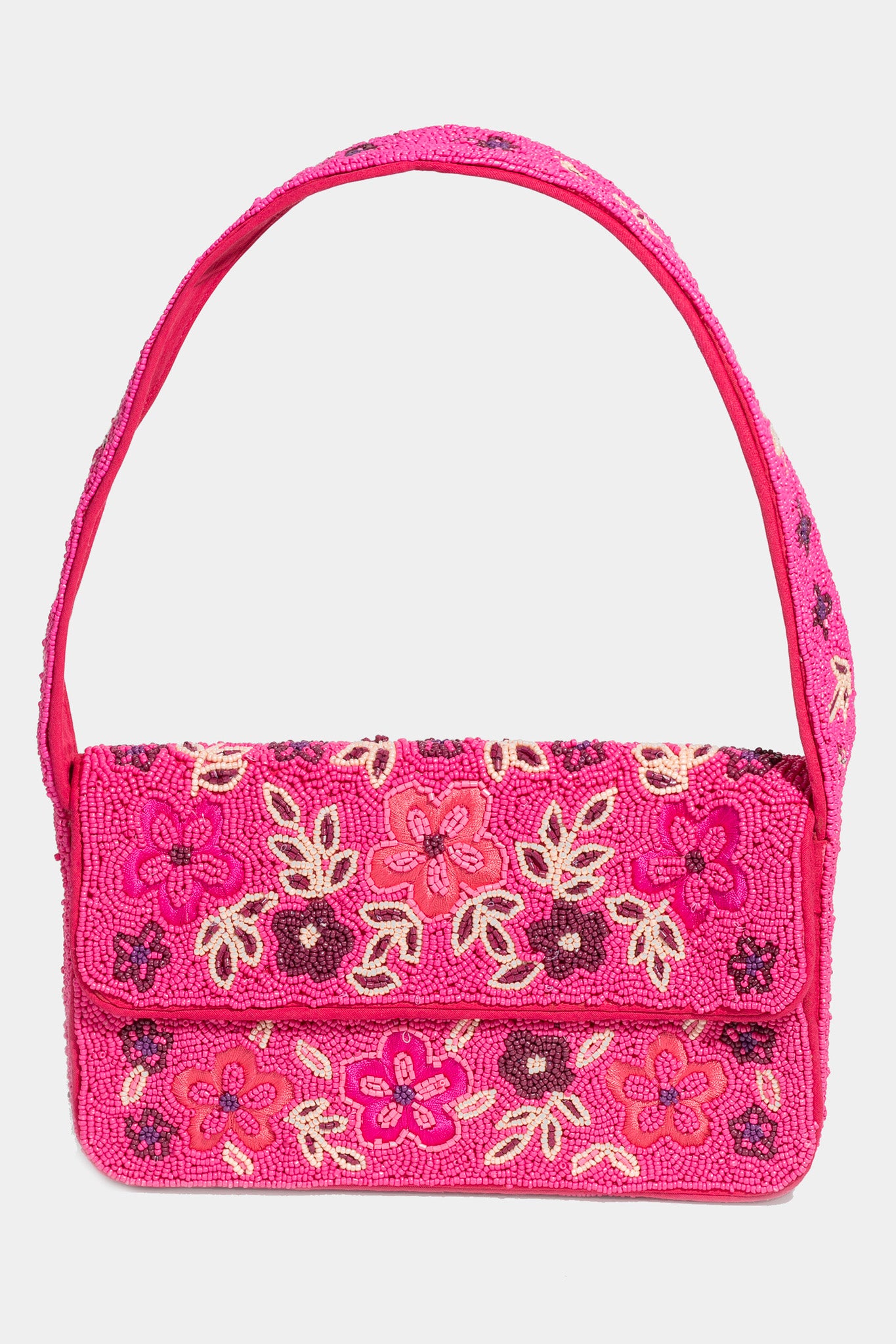 Pink Lagunita hand beaded shoulder bag by ANTIK KRAFT, featuring intricate seed-beaded patterns, a single shoulder strap, and a magnetic snap closure. The bag includes one interior card slot and measures 9.75 inches in length, 2 inches in width, and 6.5 inches in height.