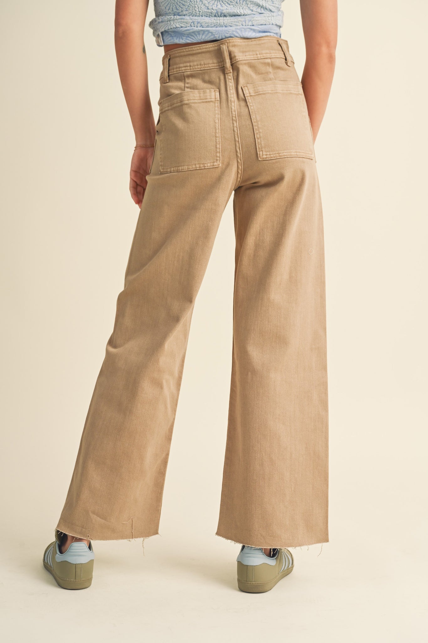 Nucifera Wide Leg Pant by Larrea Cove, featuring a stylish and relaxed fit with wide legs, ideal for summer wear. The pants are designed in a light, breathable fabric, showcasing a contemporary and fashionable look. The image may include complementary accessories like sunglasses.