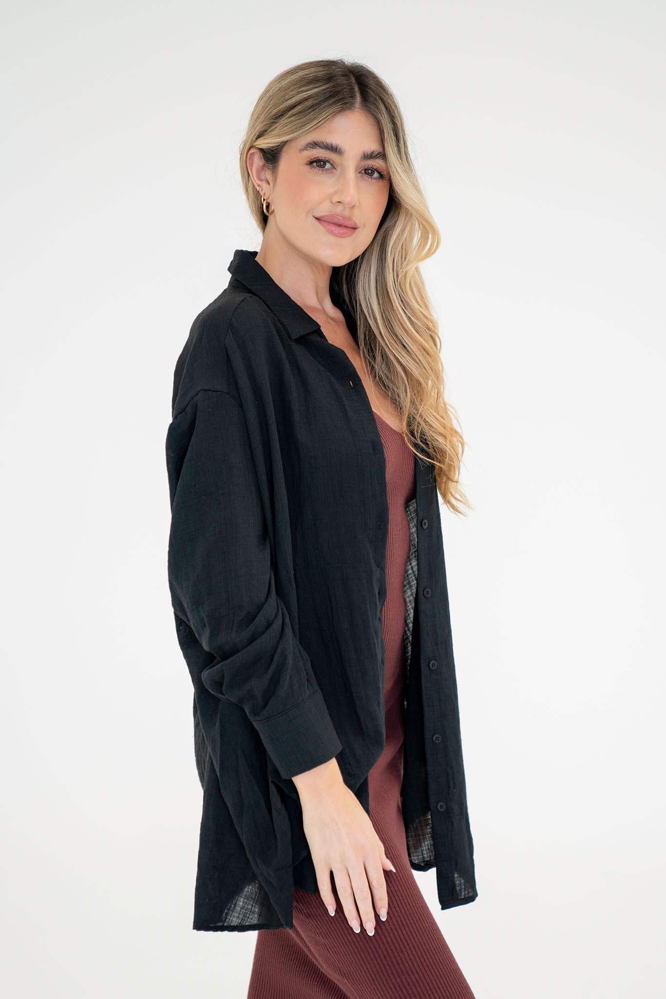 View 4 of Sea Campion Oversized Shirt in Black, a Tops from Larrea Cove. Detail: .