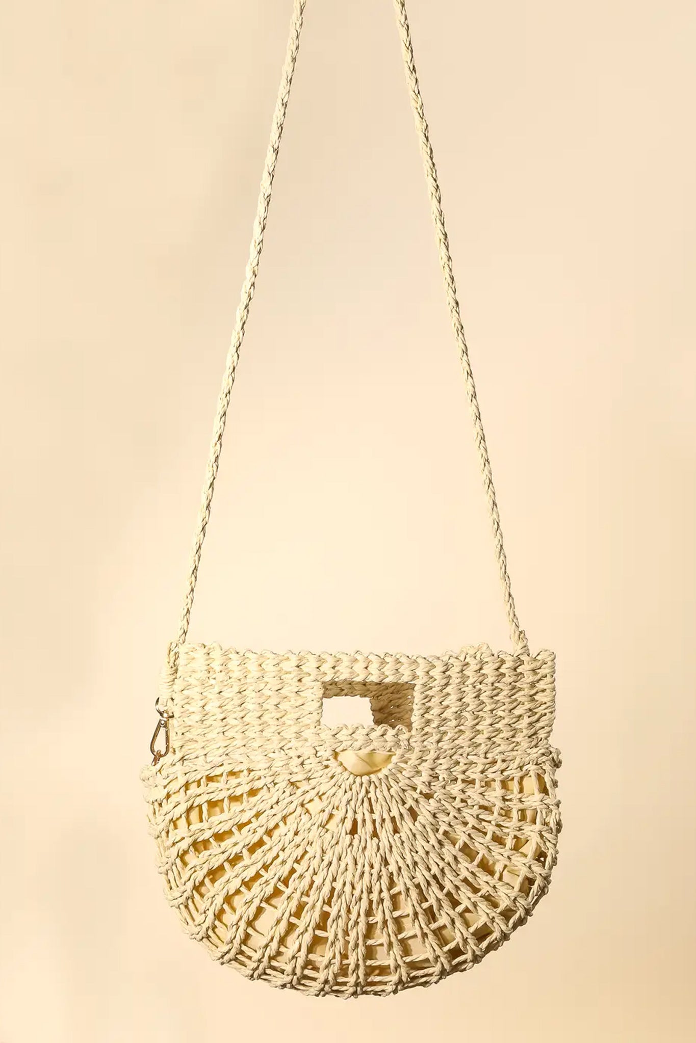 Ivory semi-circle tote bag from Larrea Cove's new arrivals, perfect for coastal adventures and effortless style.