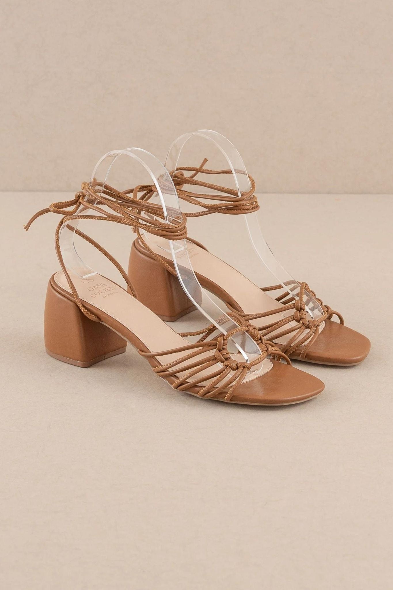 The Celia Brown Knotted Lace Up Heel by Oasis Society, featuring a stylish design with knotted detailing and lace-up closure. Perfect for summer 2024.