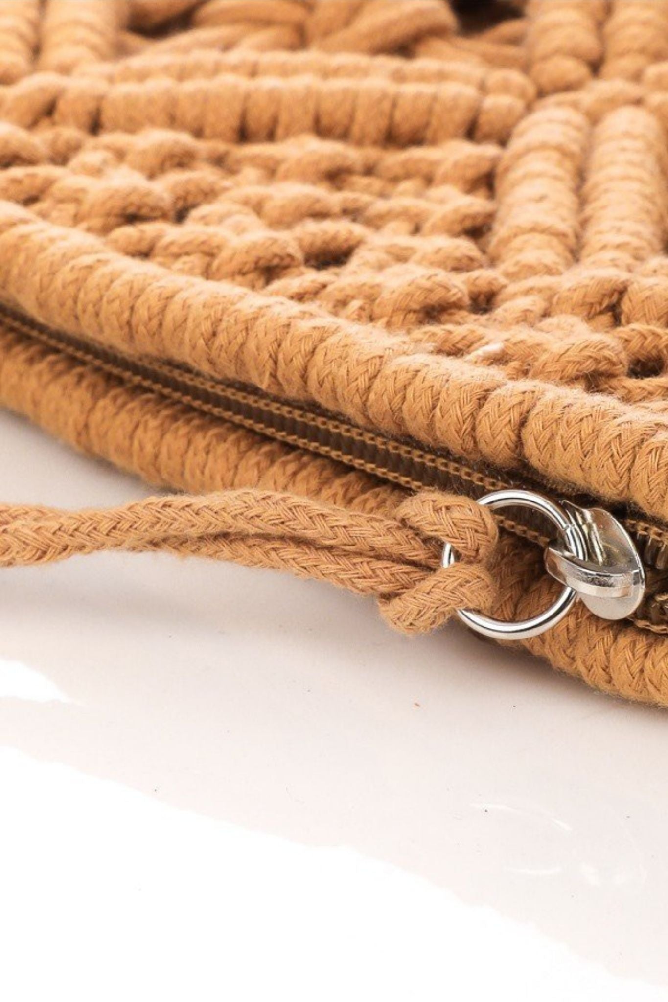 View 3 of Crochet Tassel Clutch in Tan, a Bags from Larrea Cove. Detail: .