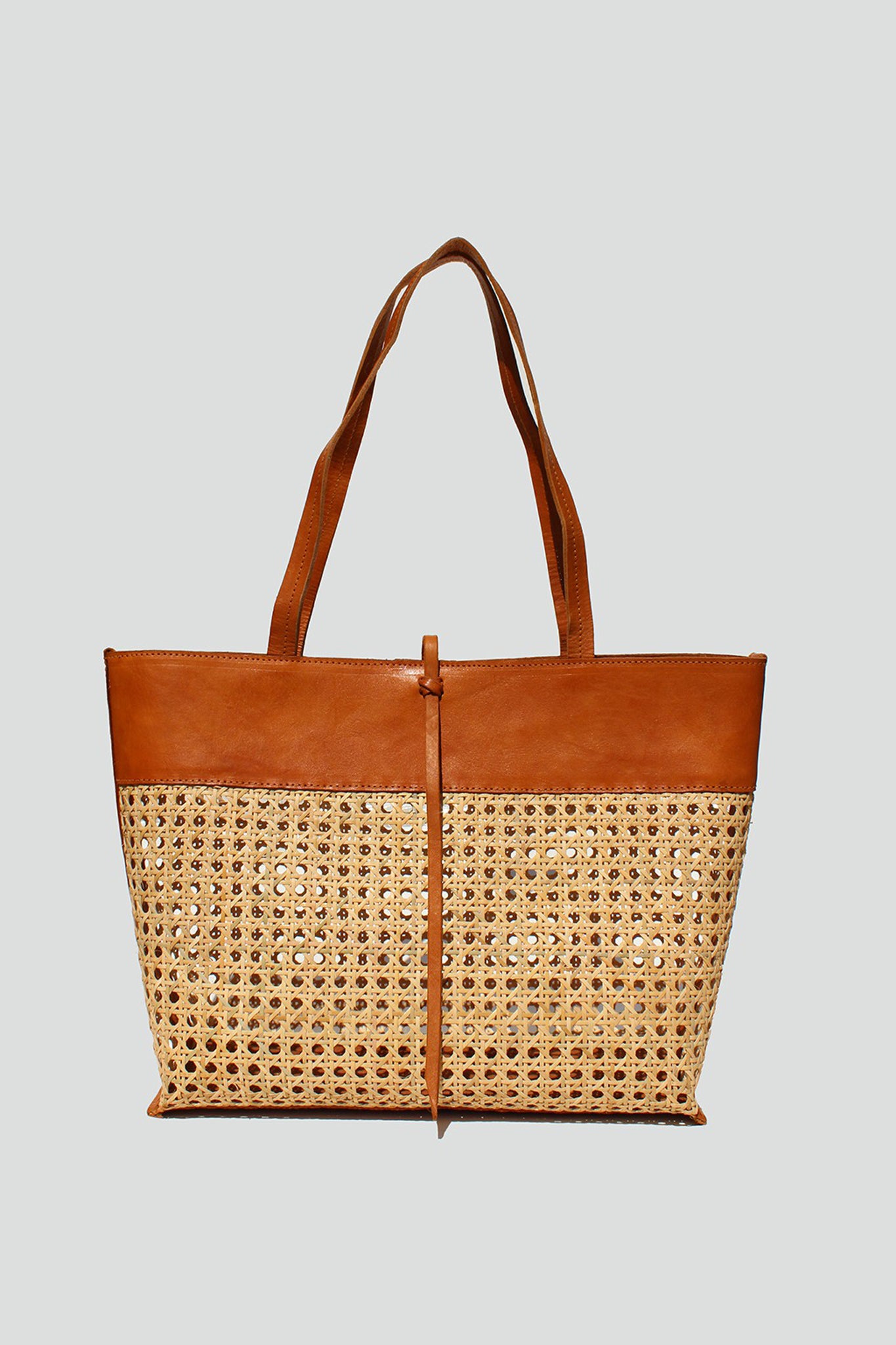 View 1 of Roro Tote in Tan, a Bags from Larrea Cove. Detail: Capture the sunny coastal vibes with the oh-so stylish Roro Tote in Tan.