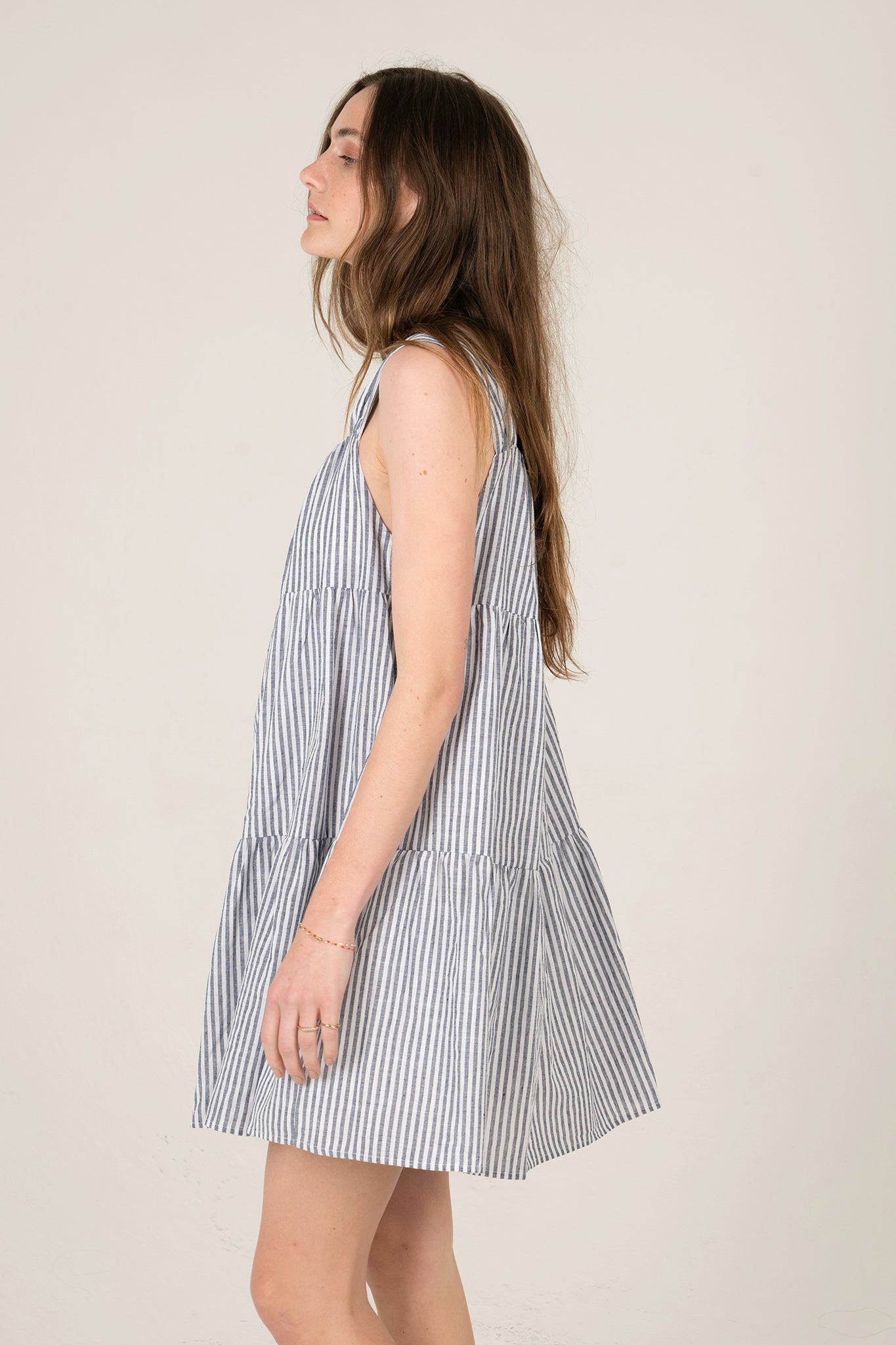 View 2 of Daphne Baby Doll Striped Dress, a Dresses from Larrea Cove. Detail: .