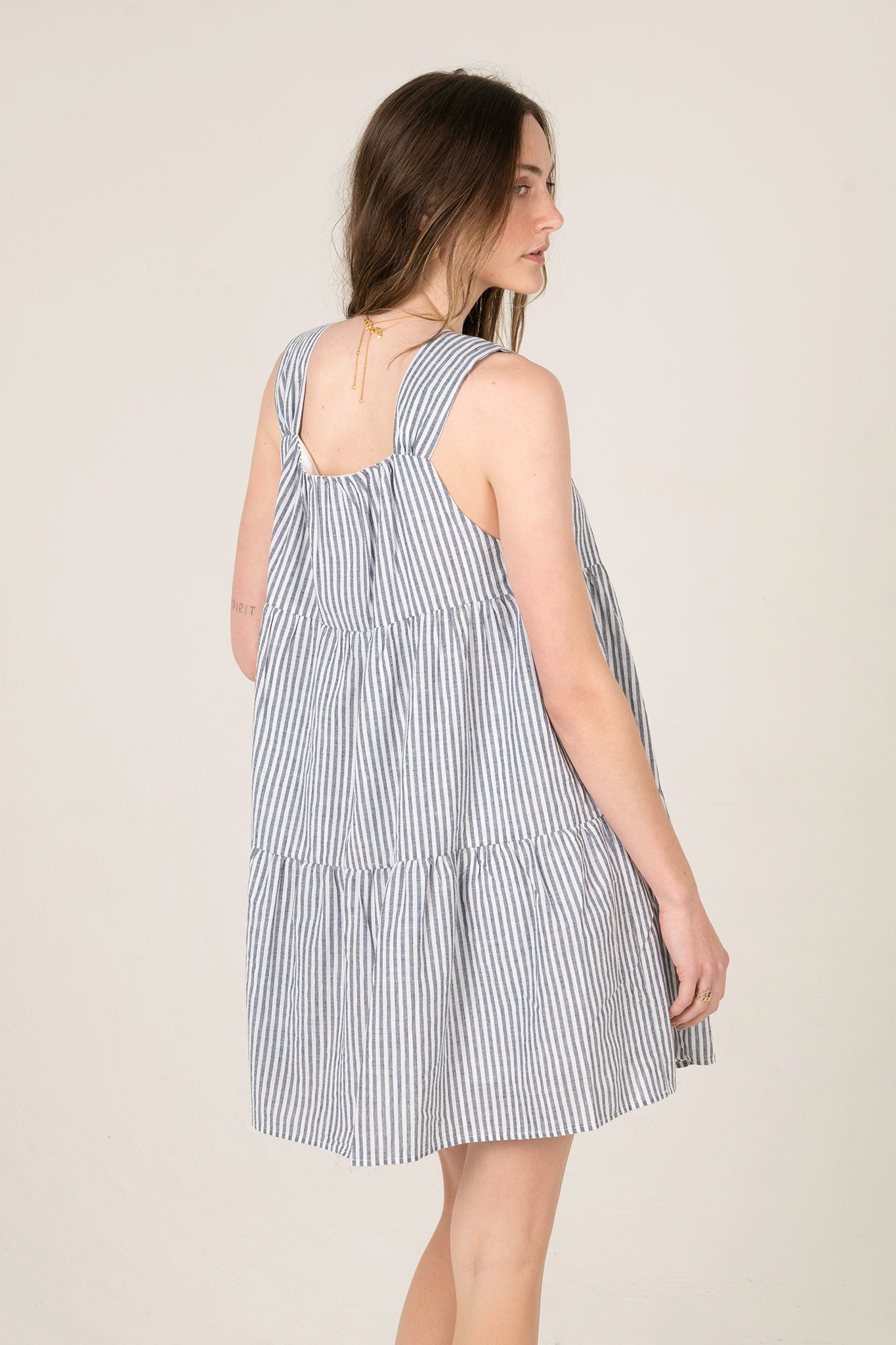 View 3 of Daphne Baby Doll Striped Dress, a Dresses from Larrea Cove. Detail: .