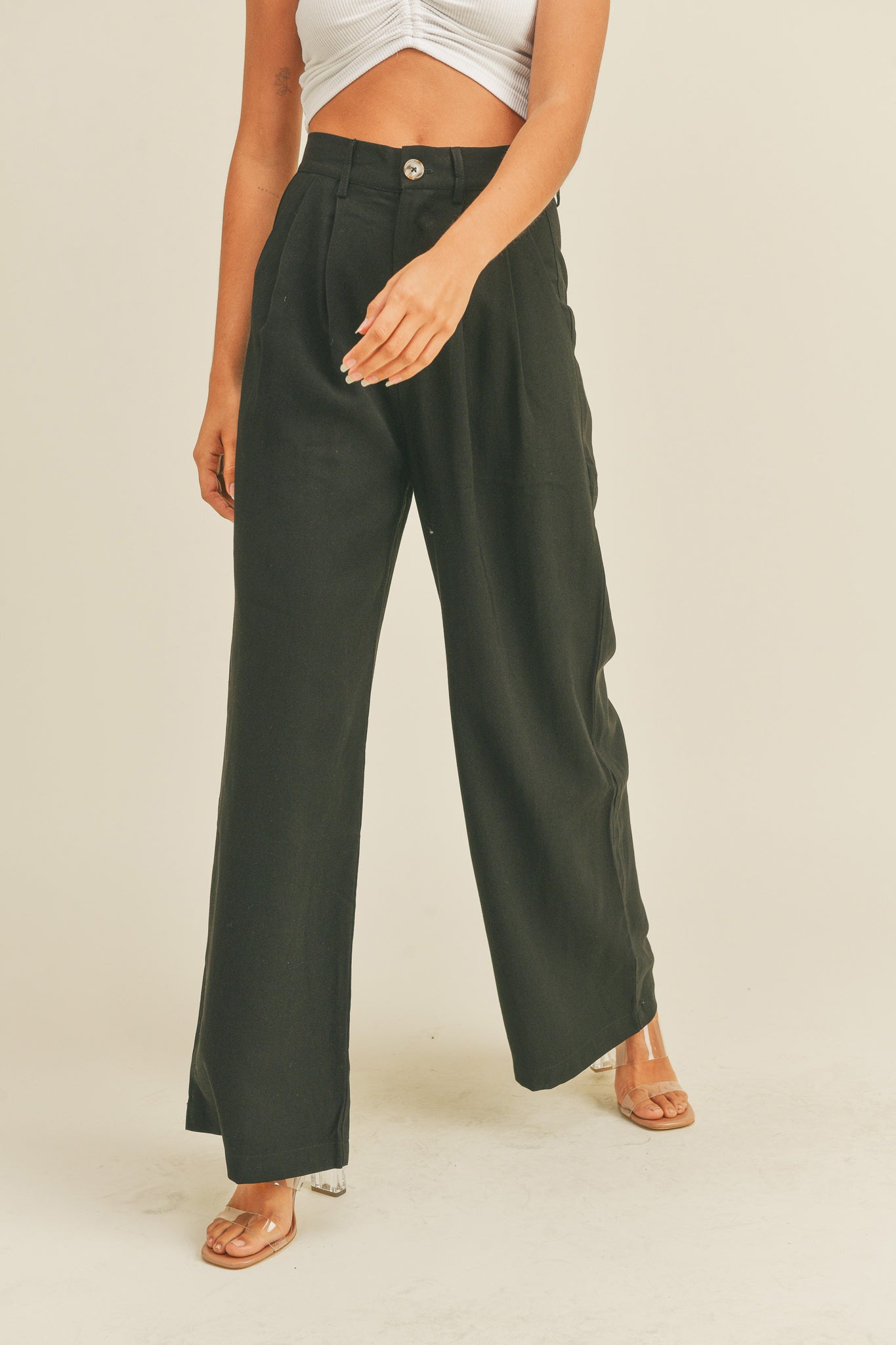 View 1 of Arid Trousers in Black, a Pants from Larrea Cove. Detail: Introducing our Arid Trousers - the perfect pant...