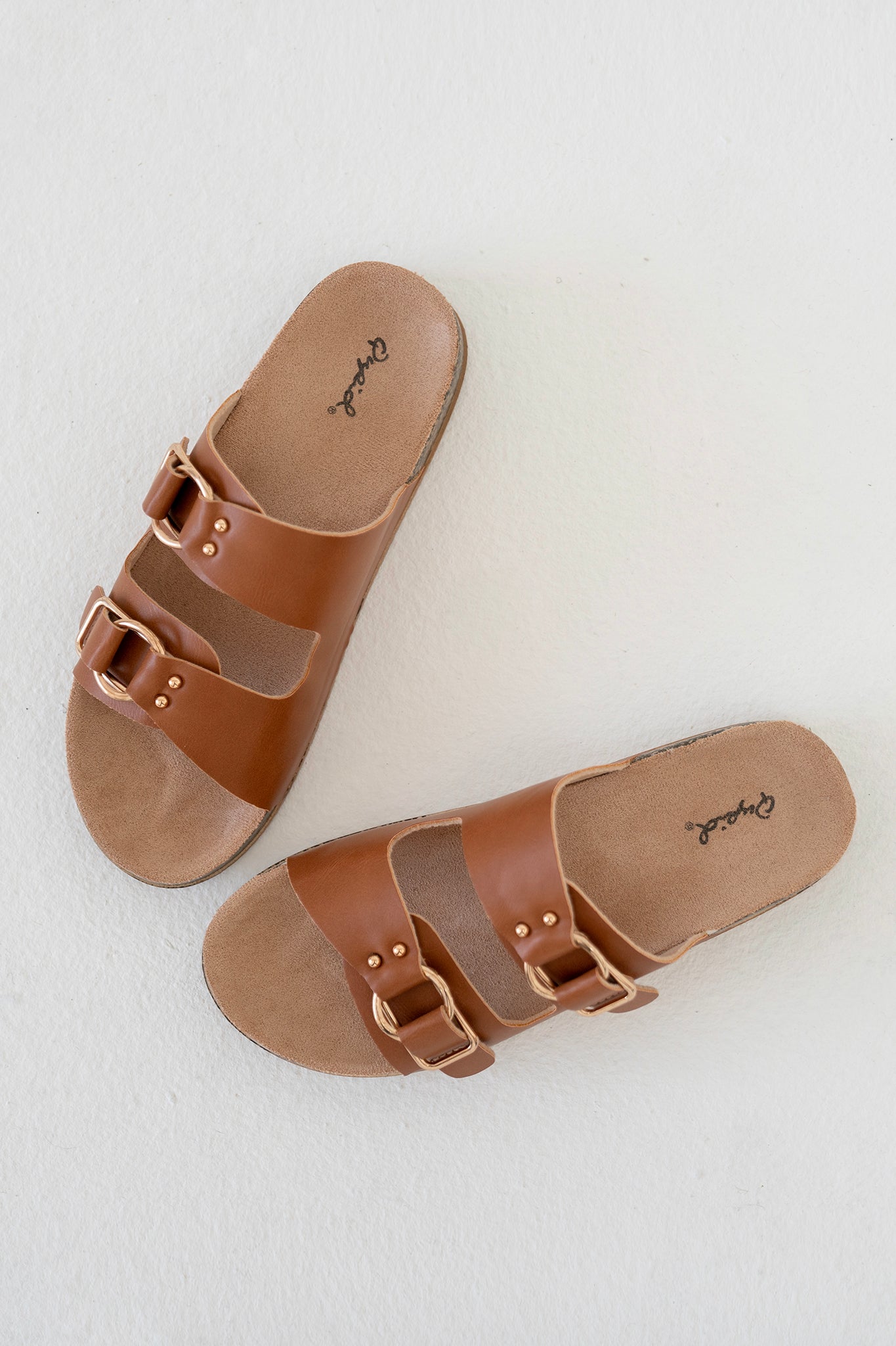 View 1 of Qupid Two Band Slide Sandal, a Shoes from Larrea Cove. Detail: Step out in effortless style with the Qupid Two Band Slide Sandal.